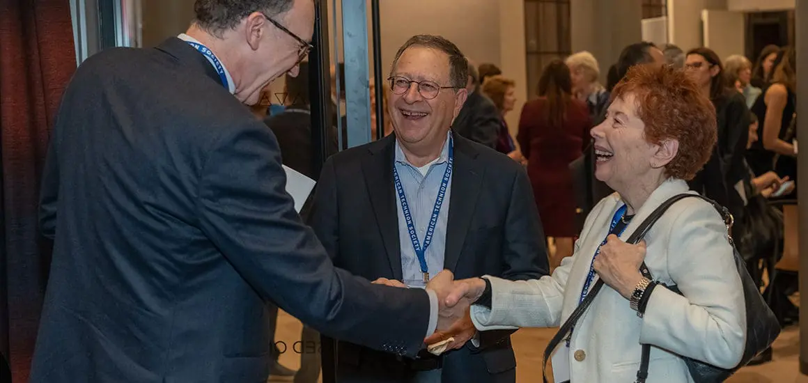 ATS board members shaking hands with ATS CEO, Michael Waxman-Lenz | Donate to Support the Technion University | American Technion Society | How to Support Israel