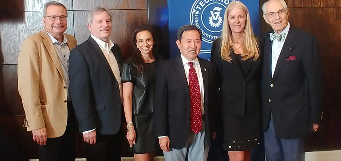 ATS staff and board members posing in front of an ATS banner | Donate to Support the Technion University | American Technion Society | How to Support Israel