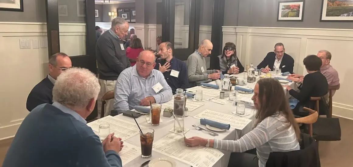 Group of people sitting around a dinner table at ATS – Baltimore event | Donate to Support the Technion University | American Technion Society | How to Support Israel