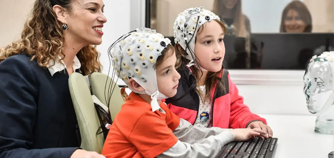 Technion Professor Tzipi Horowitz-Kraus with two children running reading difficulties tests in a Technion lab | Donate to Support the Technion University | How to Donate to Support Israel
