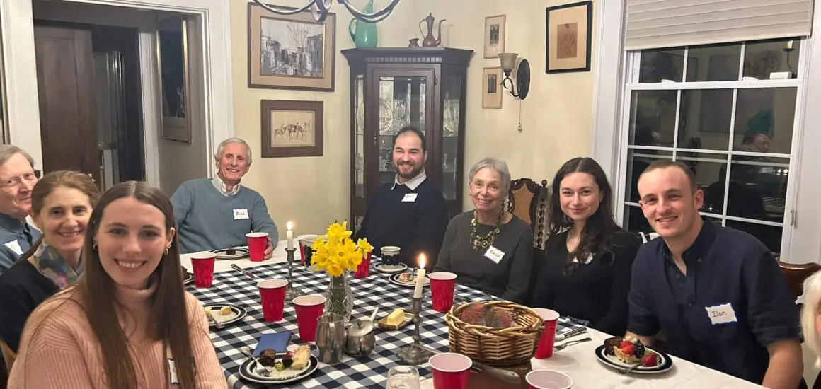 Adults sitting around a table in a home | Donate to Support the Technion University | American Technion Society