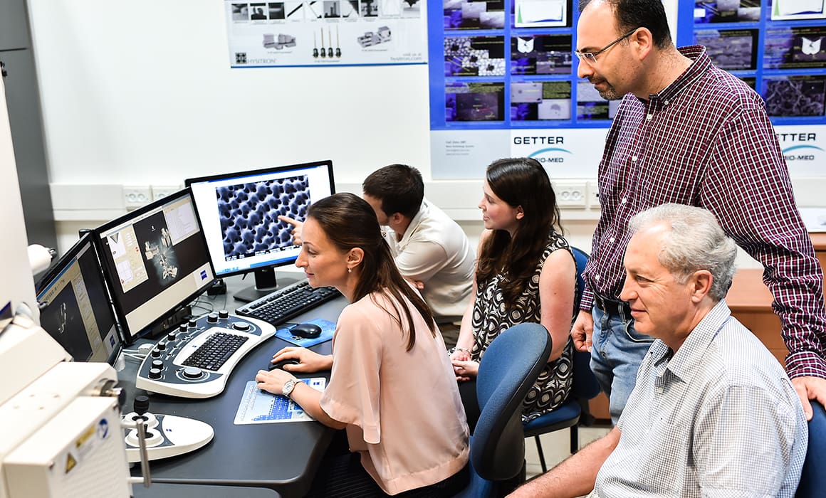Students and professors gathered around a work station looking at data on a computer | Donate to Support the Technion University | How to Donate to Support Israel | Science