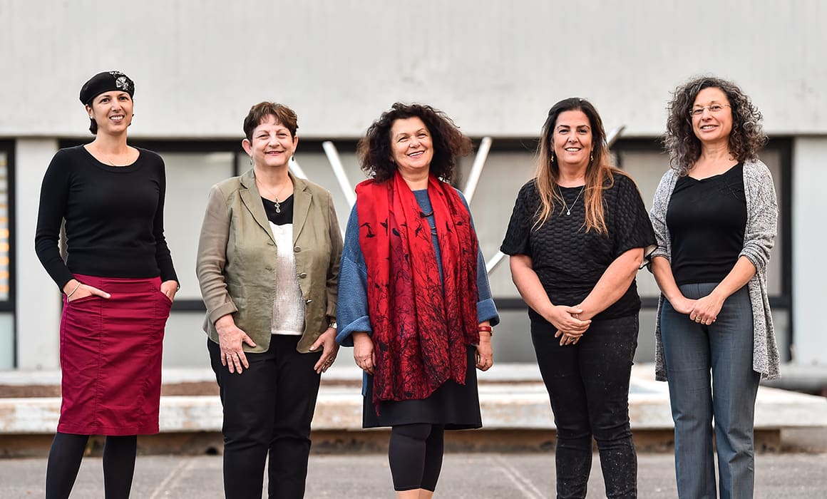 Women of the Technion posing outside of a campus building in Haifa.