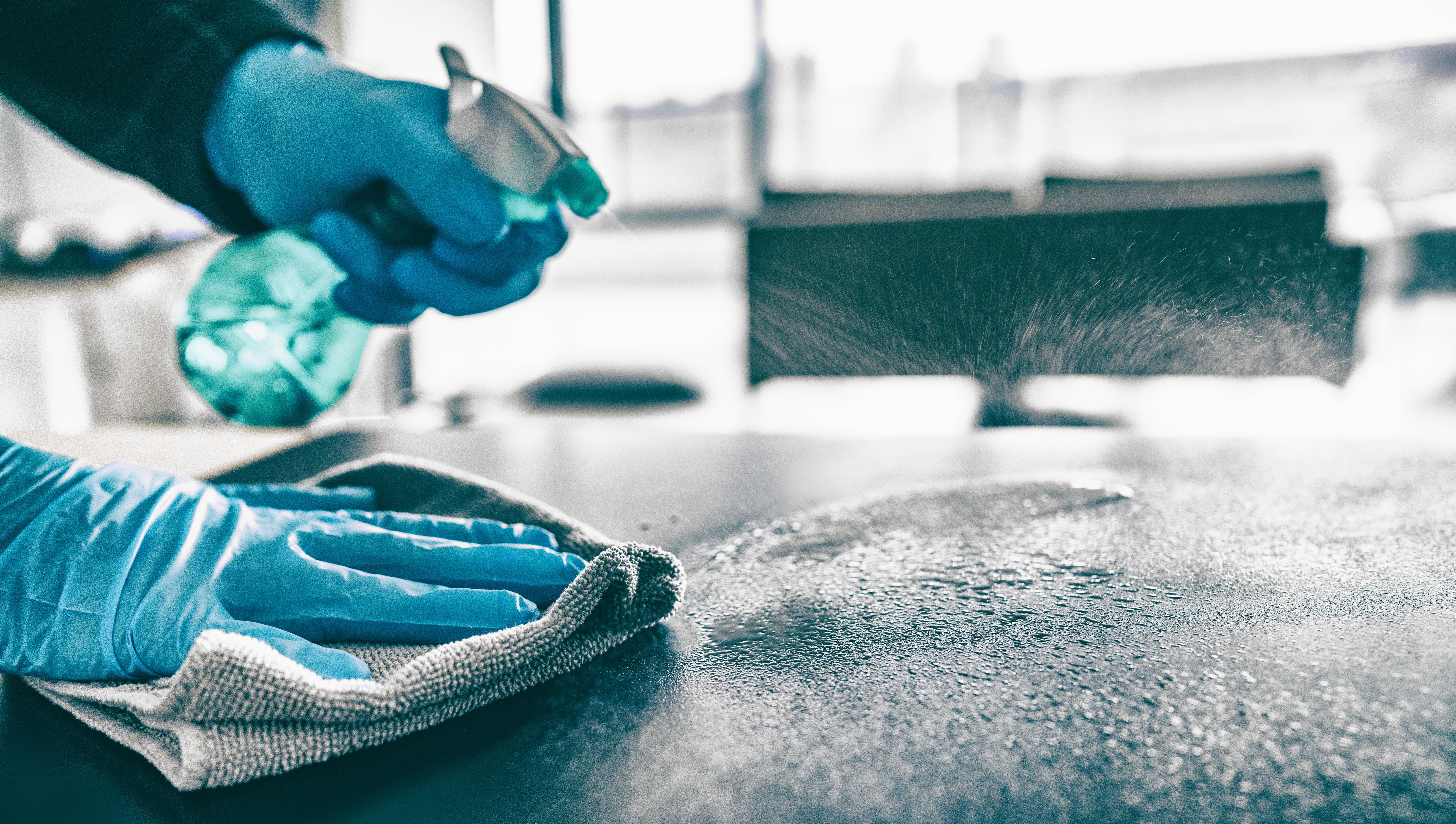 Cleaning home table sanitizing kitchen table surface with disinfectant spray bottle washing surfaces with towel and gloves. COVID-19 prevention sanitizing inside. | Donate to Support the Technion University | How to Support Israel