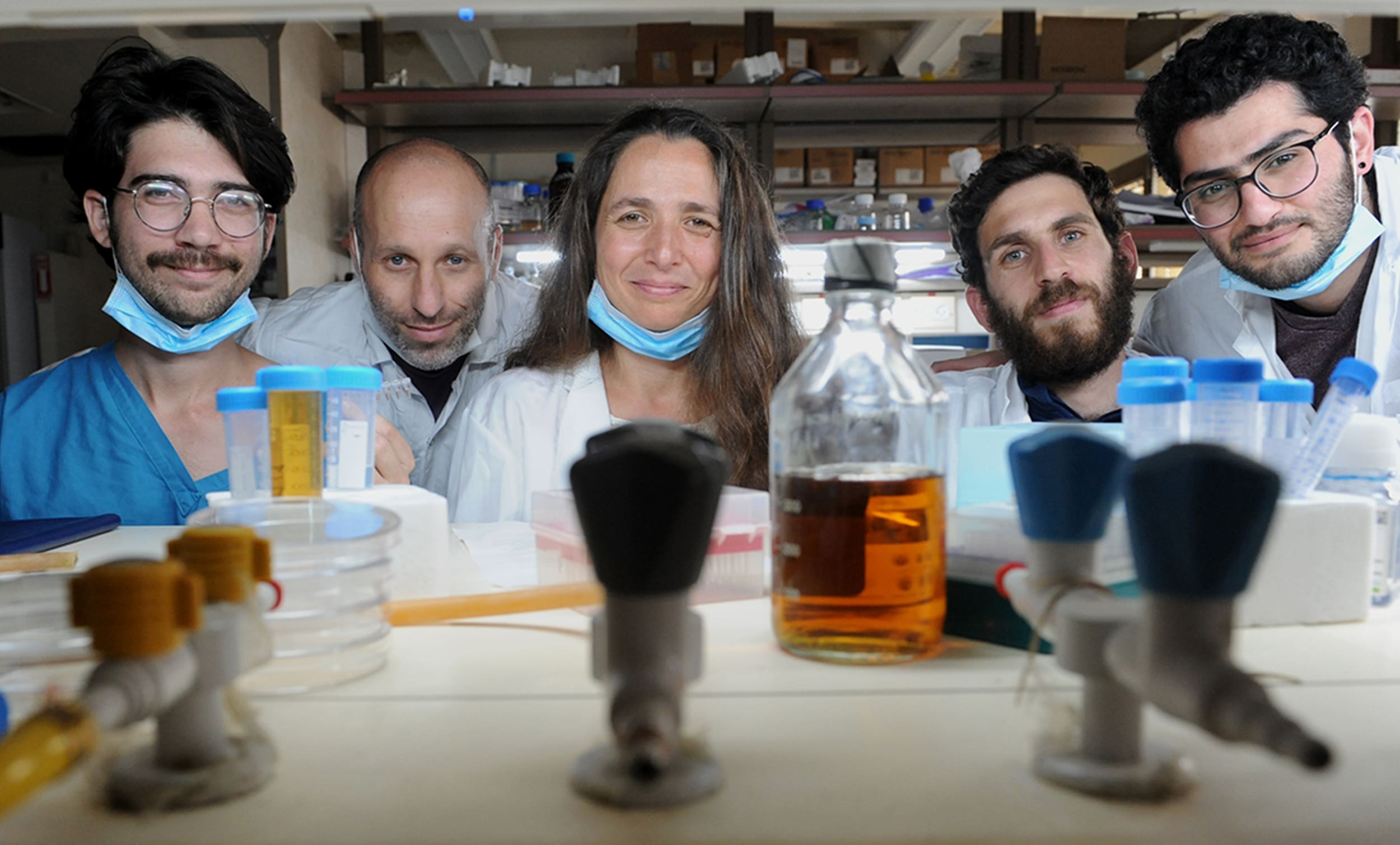 technion researchers who developed at-home COVID-19 testing kit wearing blue masks in a technion lab in haifa israel | Donate to Support the Technion University | American Technion Society
