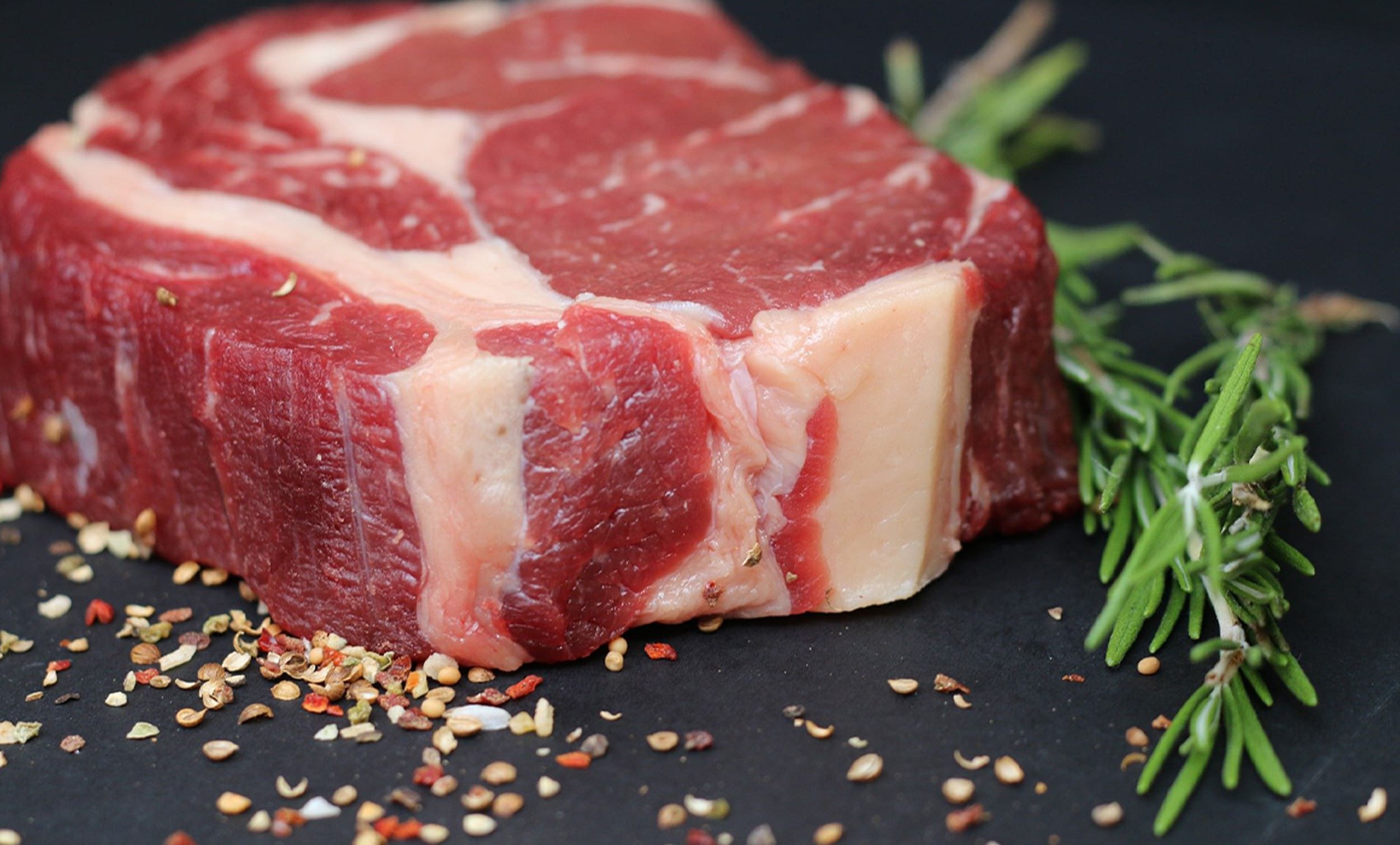 Raw meat with spices and herbs