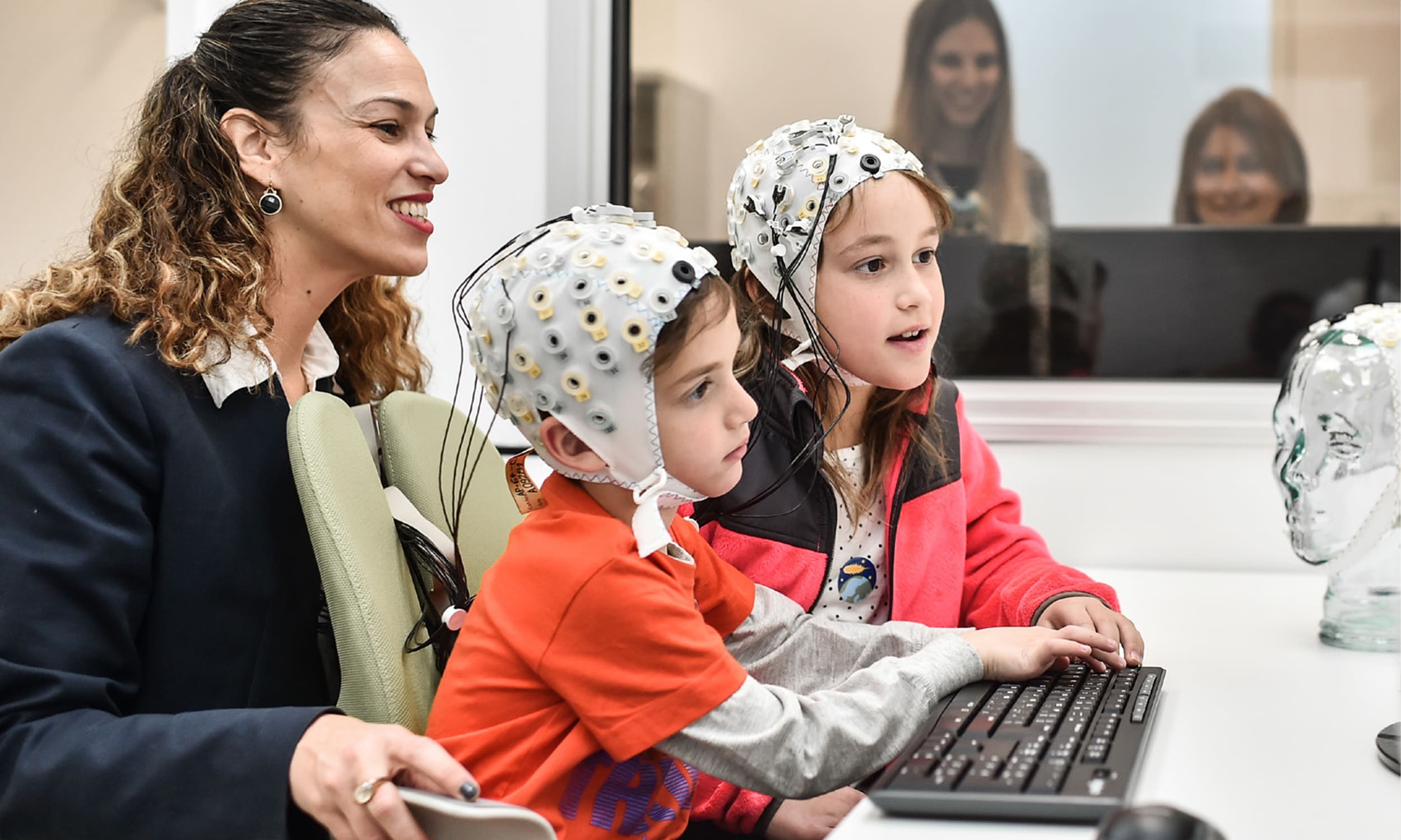 Technion Professor Tzipi Horowitz-Kraus with two children running reading difficulties tests in a Technion lab | Donate to Support the Technion University | How to Donate to Support Israel