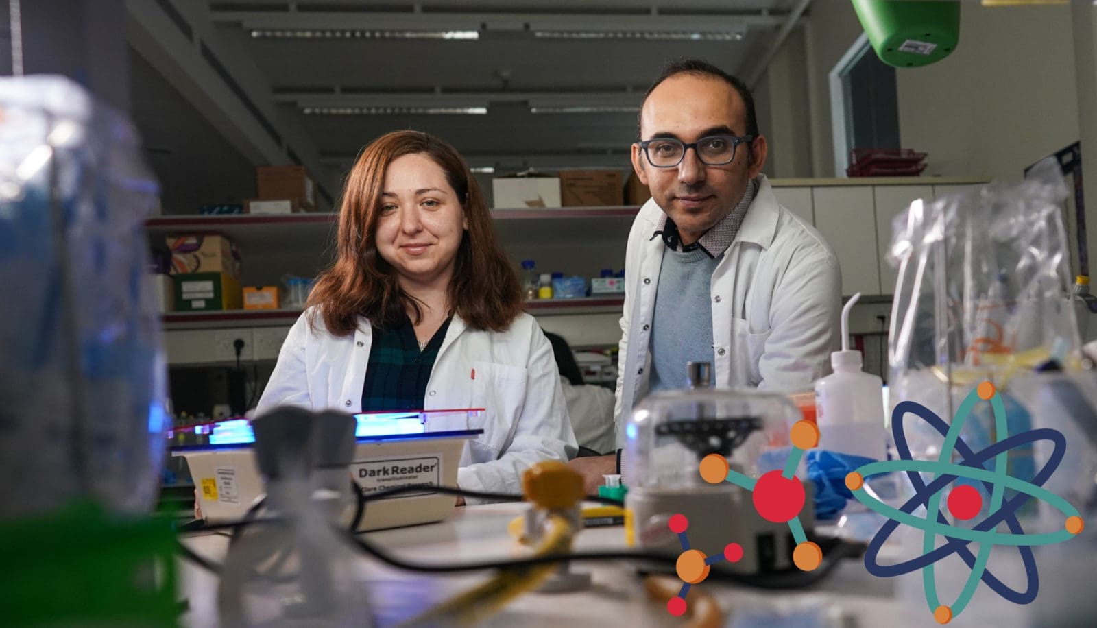 Asst. Prof. Ramez Daniel with doctoral candidate Natalia Barger, genes and human cell researchers in a lab with lab instrucments | Donate to Support Israel | Technion University