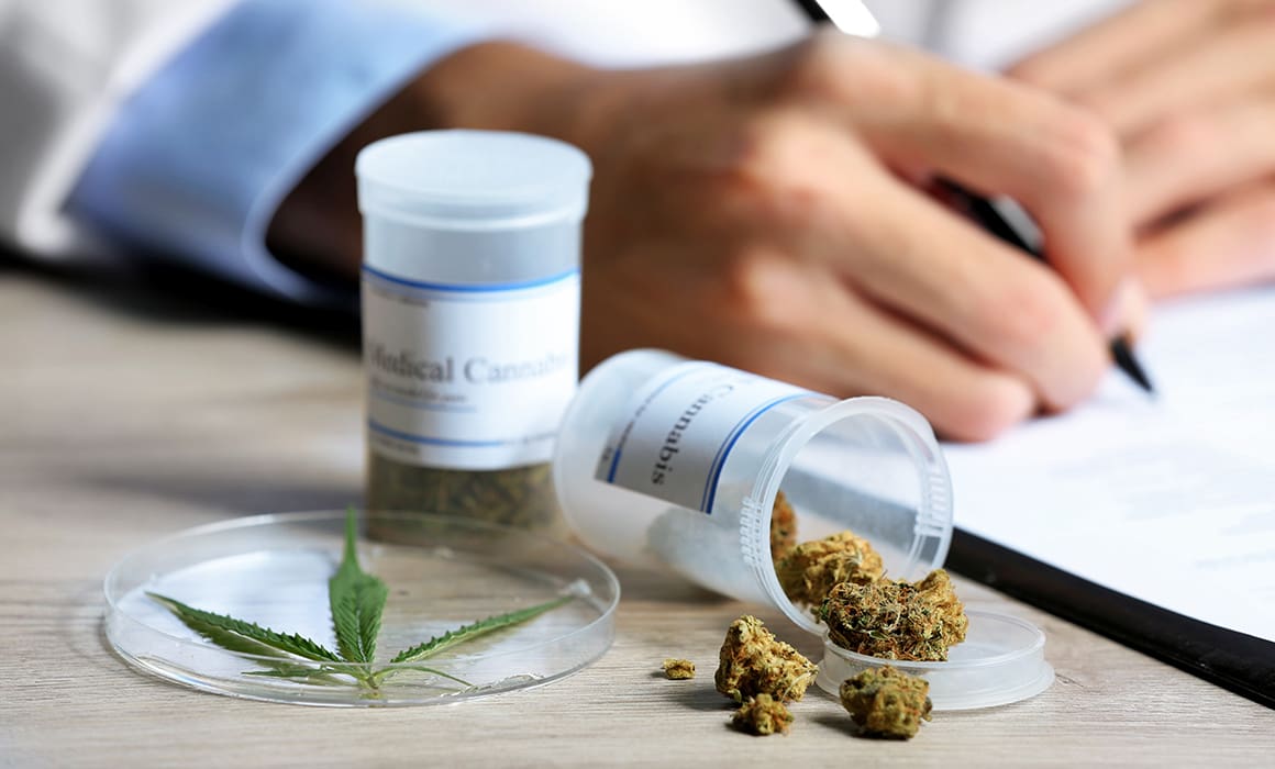 medical cannabis for pain management in prescription bottle with person writing in notebook | Donate to Support Israel | Technion University