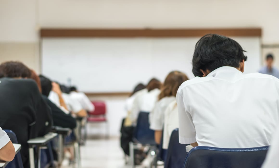 young students sitting at desks taking final exams in a classroom | Donate to Support Israel | Technion University