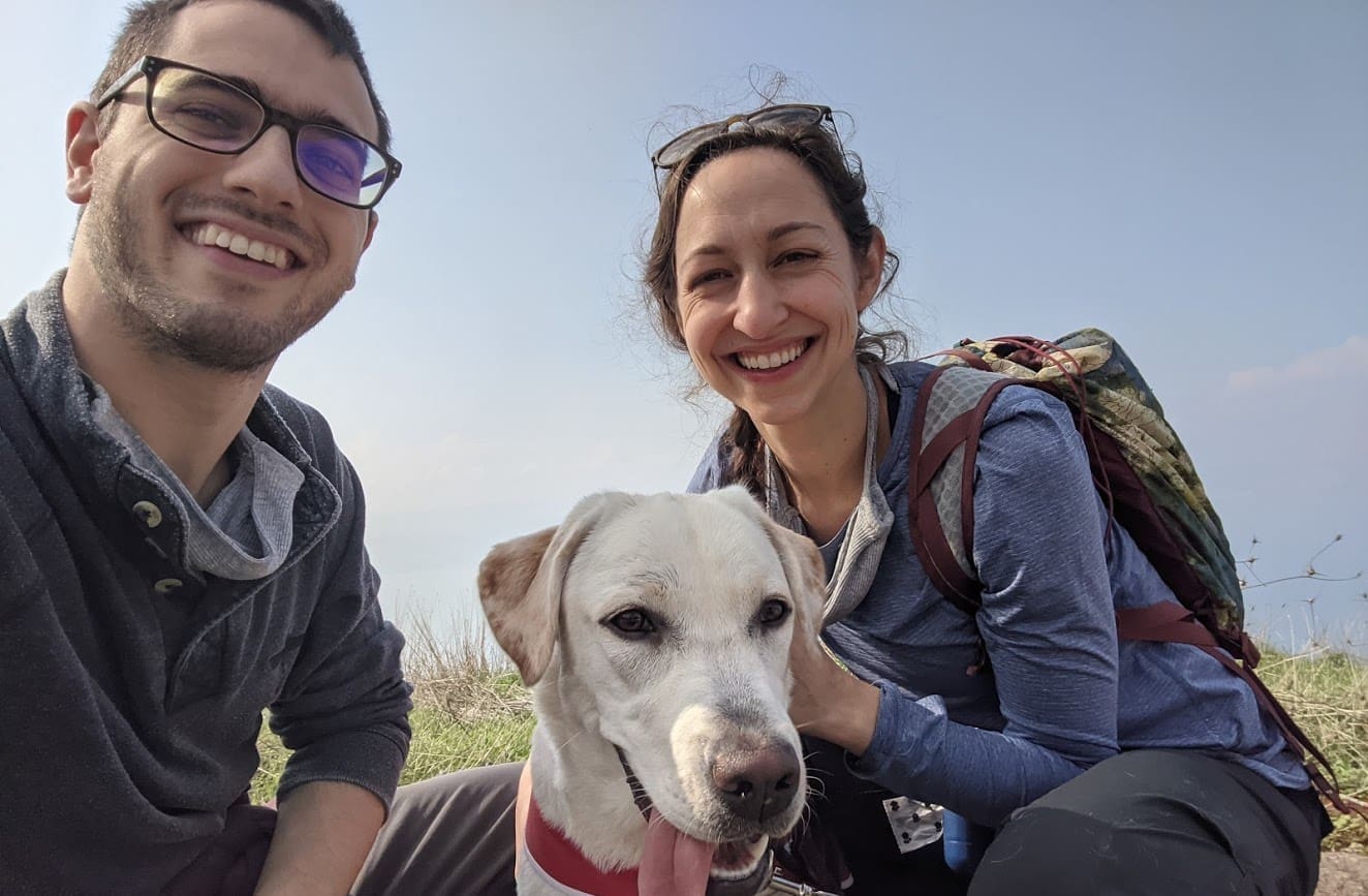 adam hope and anne kitzmiller with yellow lab dog