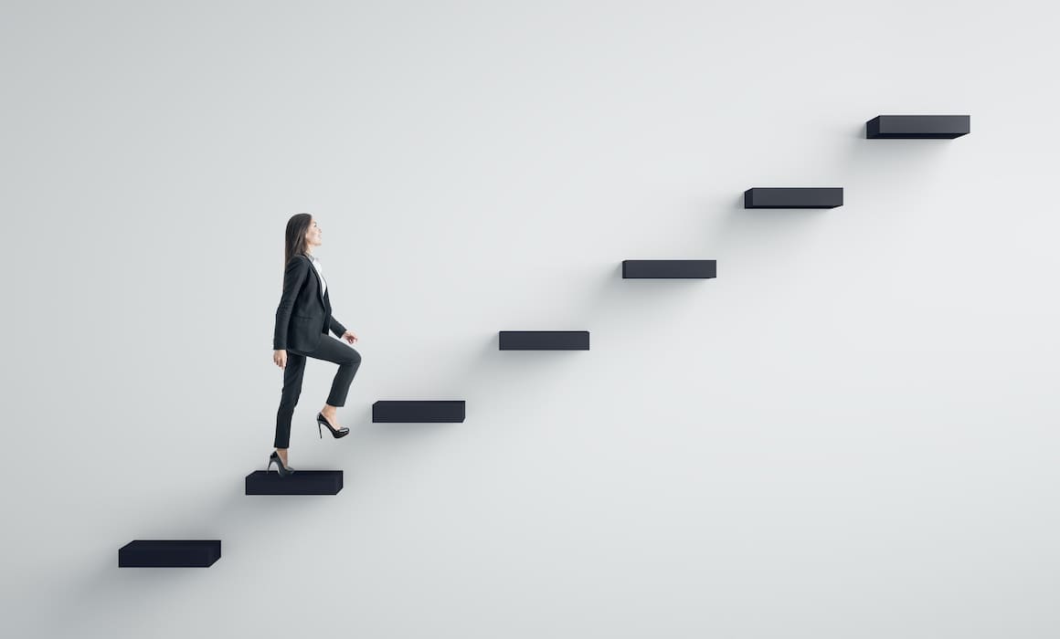 woman in STEM in suit climbing stairs floating on white wall | Donate to Support Israel | Technion University