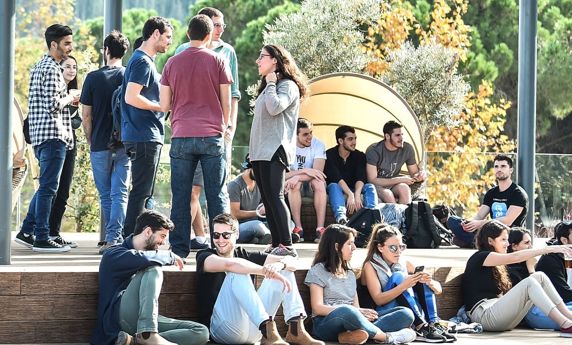 technion students on campus pre- pandemic with trees and sun | Donate to Support Israel | Technion University