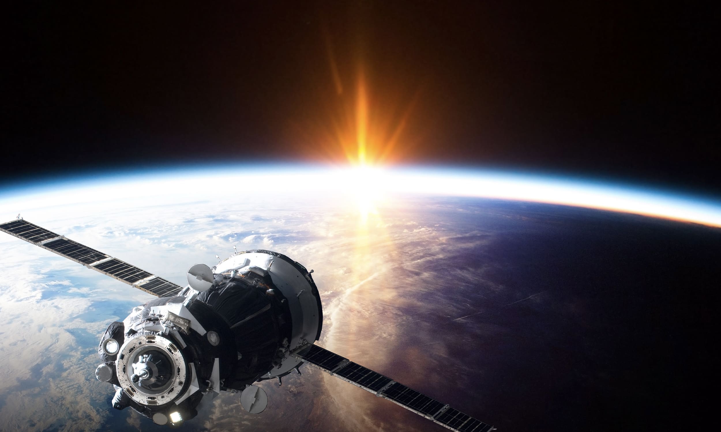 spaceship in front of earth view from space with sun rays | Donate to Support Israel | American Technion Society