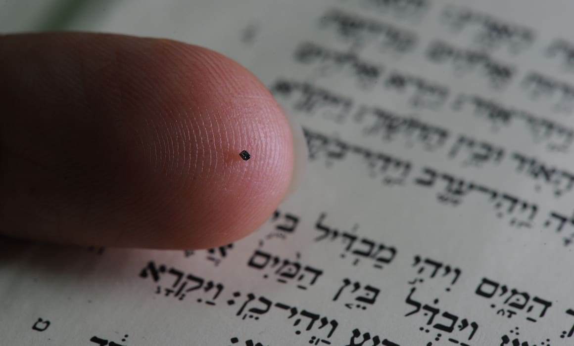 nano bible on person's finger | Donate to Support Israel | Technion University