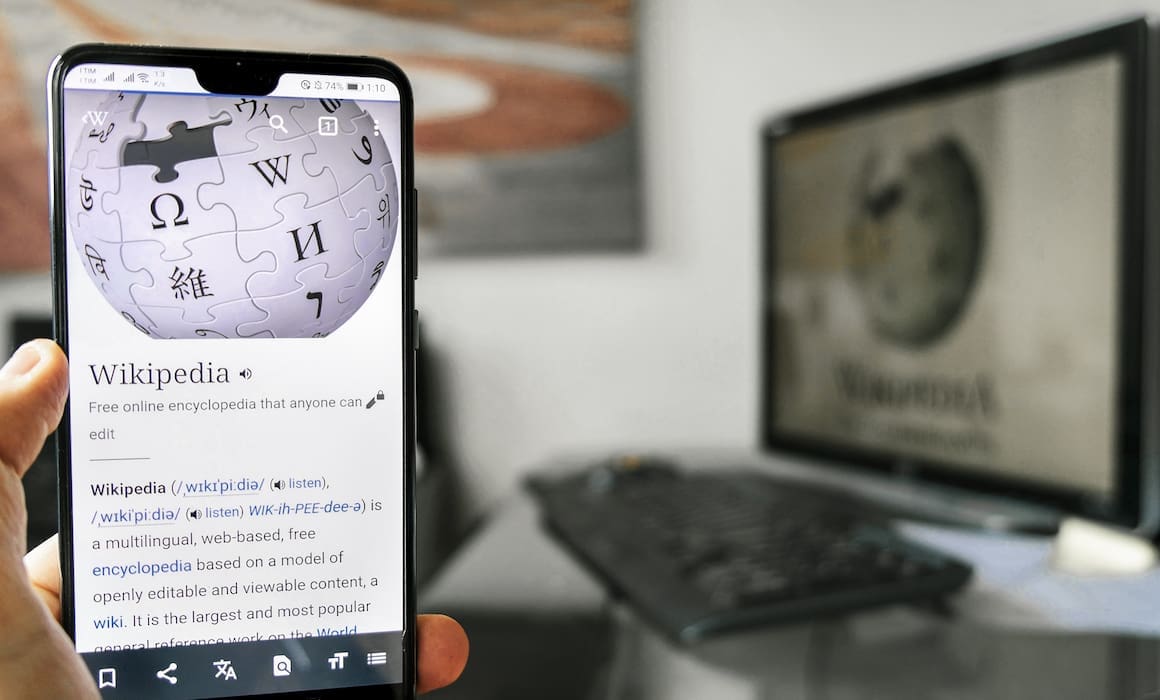 wikipedia shown on smartphone screen with desktop computer in background | Donate to Support Israel | Technion University