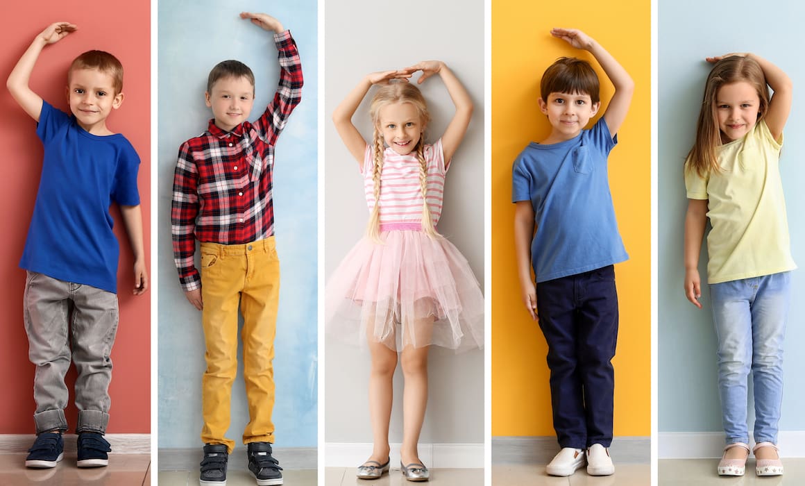 five children measuring their height against a wall | Donate to Support Israel | Technion University | American Technion Society