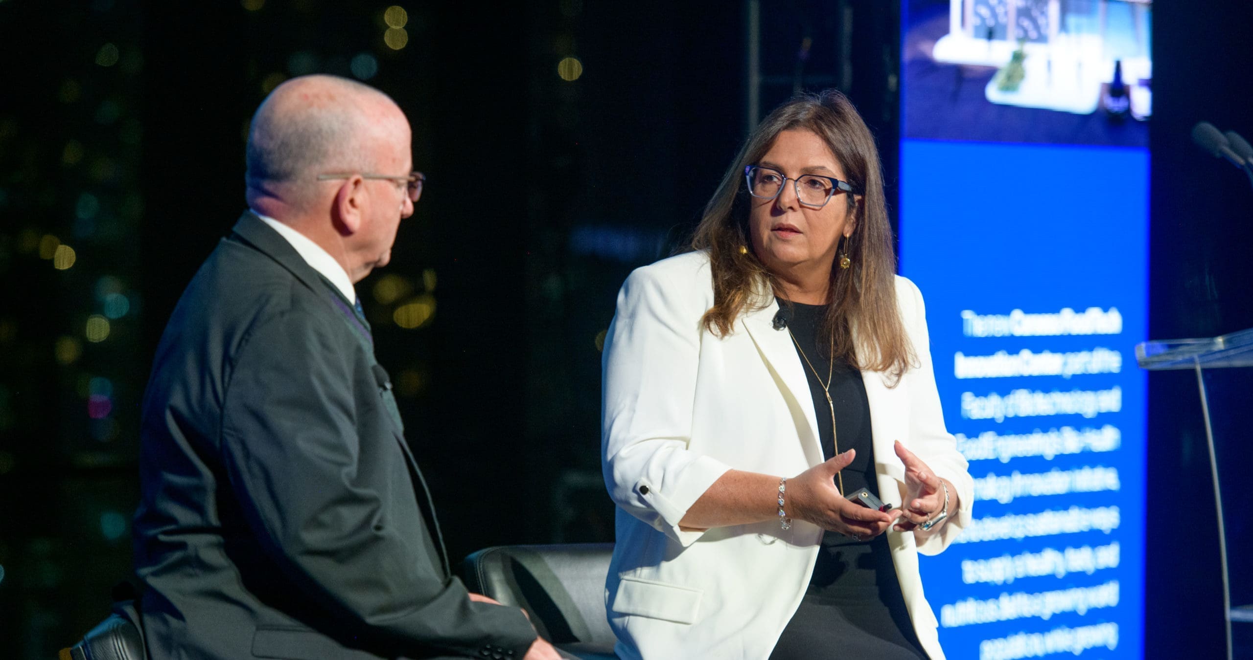 technion prof. marcelle machluf and technion evp wayne kaplan on stage talking | Donate to Support Israel | Technion University | American Technion Society
