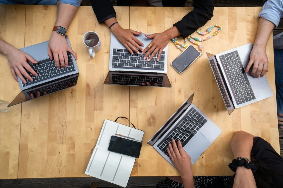 four people at a desk with laptops| Donate to Israel | Support the Technion University