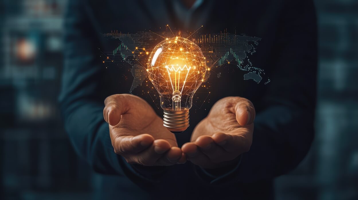 person in black shirt with hands palm up and ai generated lightbulb with gold sparks for israeli innovation | Donate to Israel | Support the Technion University