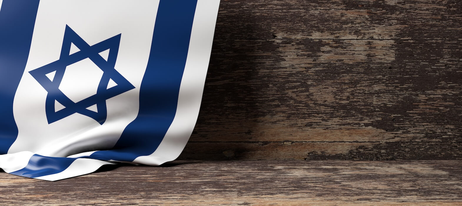 israeli flag in front of wooden background for defense-tech | Donate to Israel | Support the Technion University