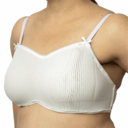 Woman's torso wearing a newly developed bra in front of white background.