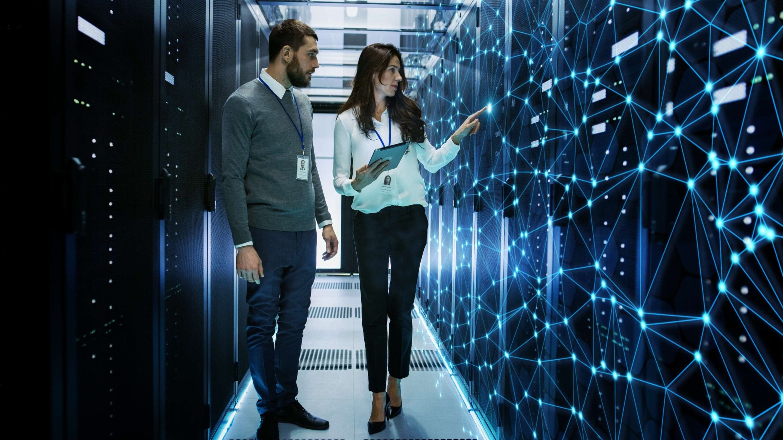 Technion AI Trailblazers | Man and woman standing in futuristic data center